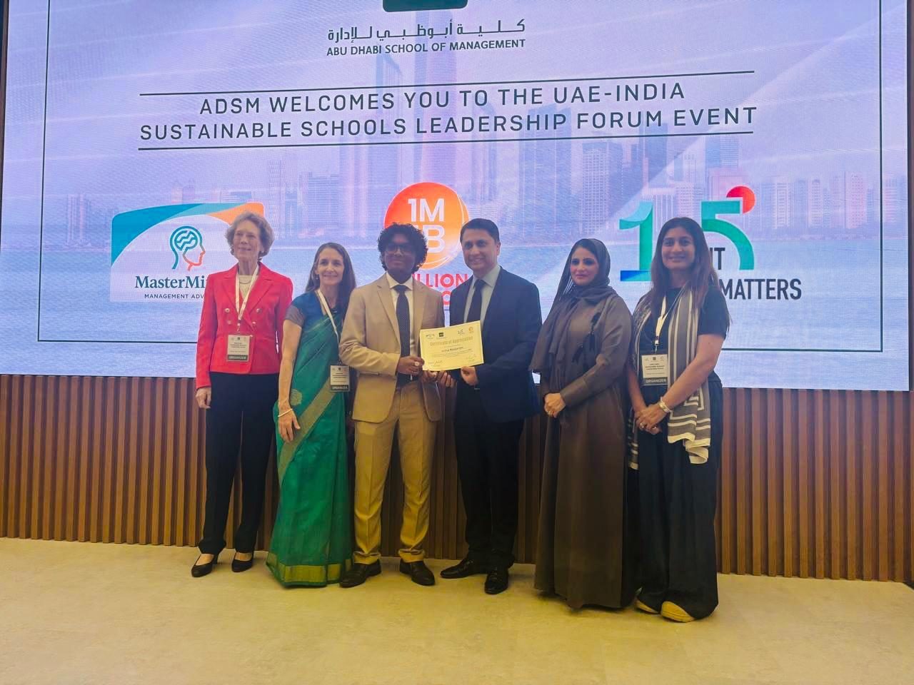 Hrithik Manikandan receiving a certificate of appreciation at the UAE–India Sustainable Schools Leadership Forum